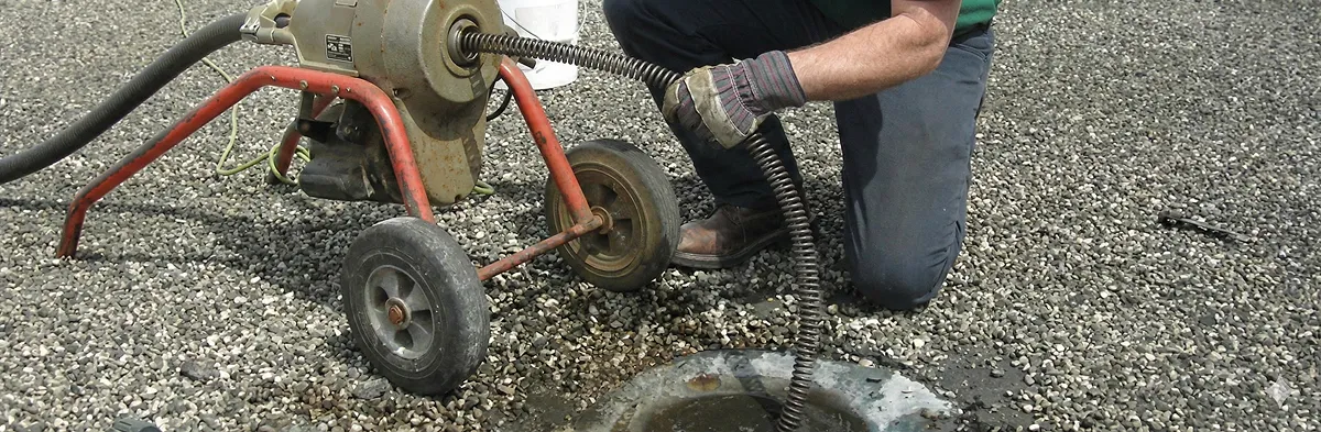 sewer rodding technician actively removing blockages from a sewer line in Tucson, AZ