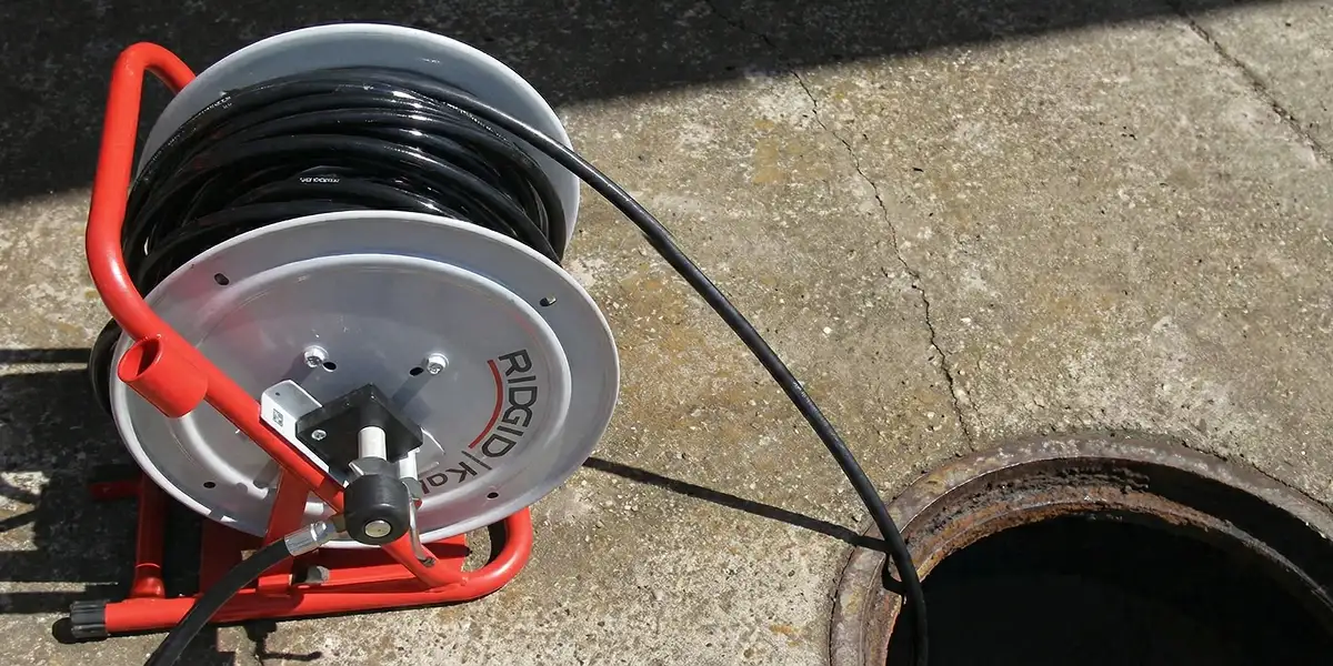 sewer rodding equipment prepared to clear clogged sewer lines in Tucson, AZ